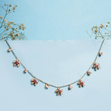 Floral Whisper Necklace in 14K gold with ruby-centred florals and Polki drops.