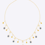 Sapphire and Polki gemstone cascade necklace in 14K gold with warm-toned stones.