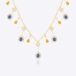 Sapphire and Polki gemstone cascade necklace in 14K gold with warm-toned stones.